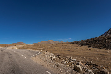 isolated picturesque tarmac road in himalaya mountain