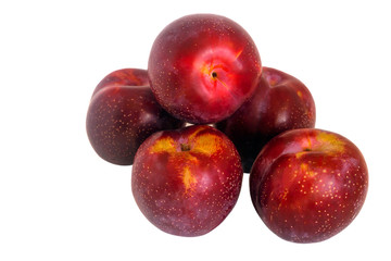 Fototapeta na wymiar Ripe sweet juicy plums on an isolated white background.