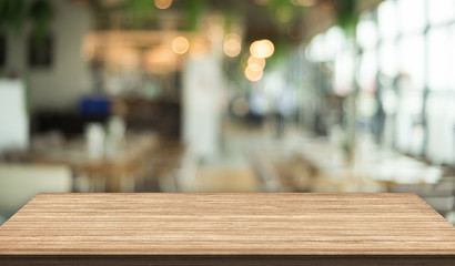 3D Rendering, Wooden top table with bokeh light effect and blur restaurant on background, blur background