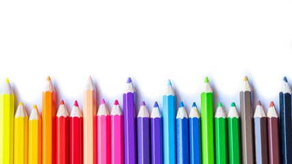 Color pencils on white background. Close up. multicolor for artist's painting, children's lesson, student's learning.