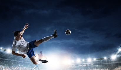 Fototapeta na wymiar Soccer player in action on a stadium
