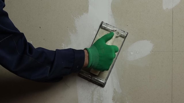 Sanding the wall before priming and painting