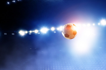 Naklejka premium Soccer ball flight over stadium
