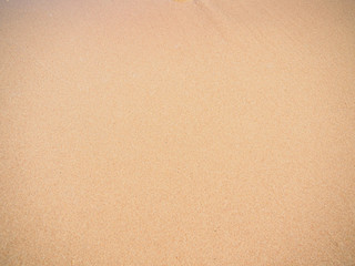 Texture of yellow sand, close up view. Abstract yellow background. Egyptian beach in february
