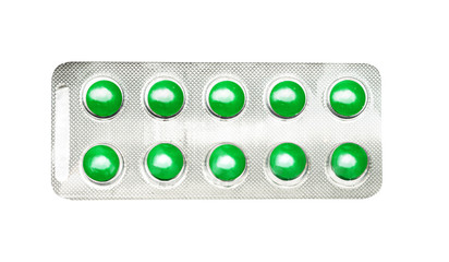 Packing round green pills, tablets. Isolated on a white.