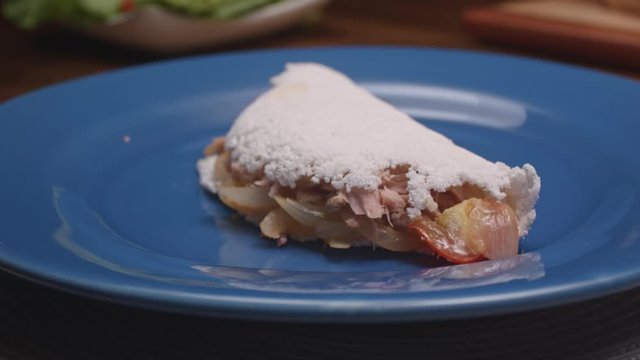 Brazilian tapioca with tuna, tomato and onion