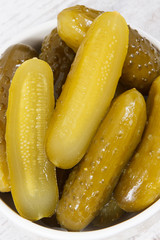 Fresh prepared homemade pickled cucumbers in white bowl