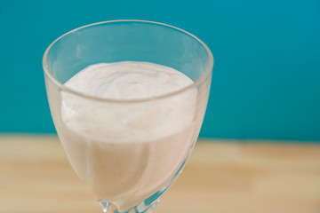 Whipped ice cream and banana in a cocktail glass.
