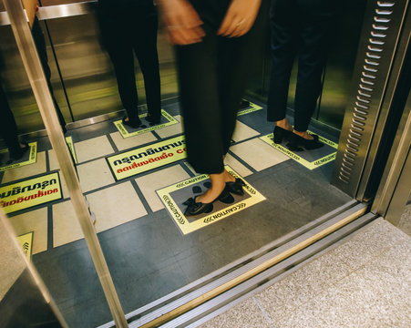 Bangkok, Thailand - 19 March 2020: Footprints in the elevator to avoid Covid-19. Cinema tone concept.