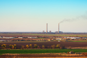 Industrial thermal power plant with smokestack