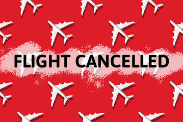 Travel, vacation ban concept. Pattern of white airplanes with text flight cancelled on red background. Top view. Flight cancellation due to impact of coronavirus COVID-19. Stay home. Airline crisis.