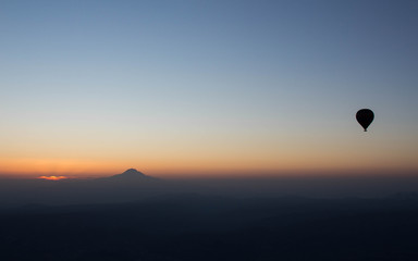 Hot Air balloon flying in Turkey Goreme Capadocia sky sunset sunrise
