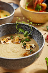 Forester soup with cheese rusks in gray bow