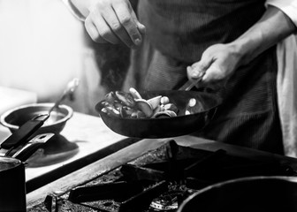 Chef cooking in a kitchen, chef at work, Black & White.