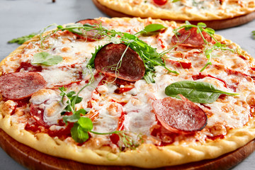 Prosciutto Funghi pizza on wooden board