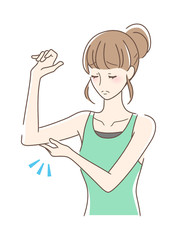 二の腕を触る女性