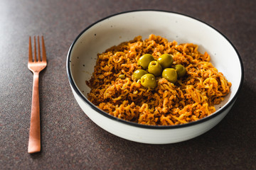 plant-based food, vegan sticky ginger noodles with green olives and breadcrumbs