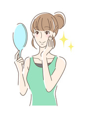 笑顔で手鏡を見る女性