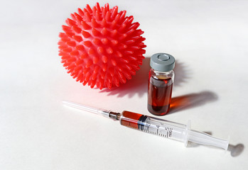 Coronavirus vaccine, syringe and COVID-19 model. Medical concept of vaccination and the fight...