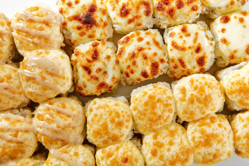 Baked rolls on white background top view