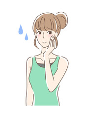 不安そうに頬を触る女性