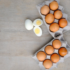 halves of boiled eggs on wooden rustic background. the view from the top
