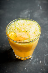 Old fashioned orange cocktail on rustic background. Selective focus. Shallow depth of field.