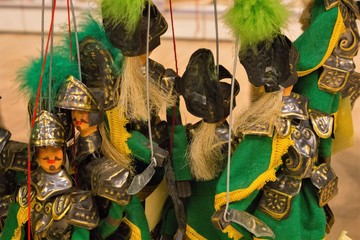 group of puppets with hanging threads typical of the Sicily Region in Italy
