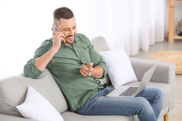 Handsome businessman working at home