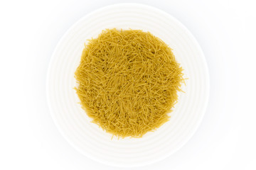 Pasta in a white plate on a white background