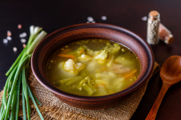 Fresh vegan soup with broccoli, cauliflower, asparagus and carrots