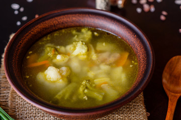 Fresh vegan soup with broccoli, cauliflower, asparagus and carrots