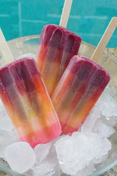 colorful popsicle ice cream popsicle in a bowl of ice
