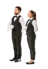 Male and female waiters on white background