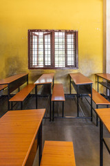 Empty classroom desks in Indian school classroom - 344413591