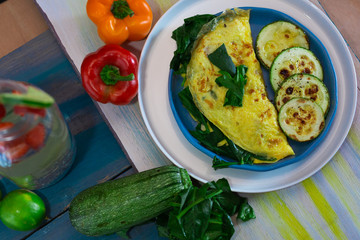 Tortilla with egg, spinach, zucchini and peppers for ketogenic diet.