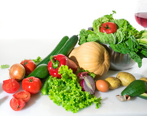 Different fresh vegetables on a white table