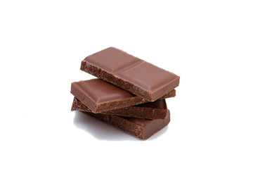 Pieces of chocolate on a white background, isolate. Broken chocolate bar