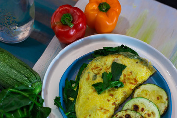 Tortilla with egg, spinach, zucchini and peppers for ketogenic diet.