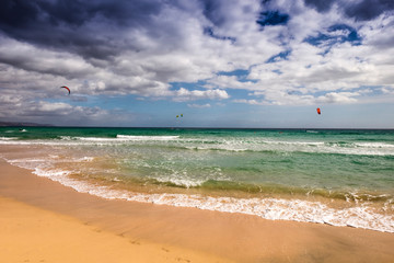 Fototapeta na wymiar Kite surfing at Sotavento beach in Fuerteventura, Canary Islands, Spain