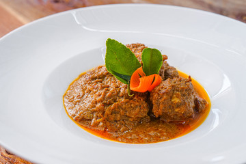 Beef Rendang Padang Food, Famous Indonesian Food, The popular Padangnese or West Sumatran dish of spicy beef stew. Detail Close Up.