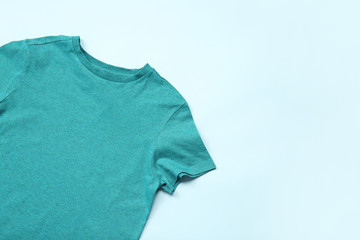 Stylish t-shirt on color background