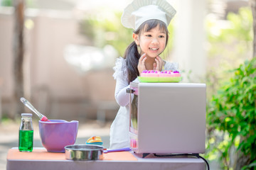 close-up of the baby's background view, dress-up fashion style, love for childhood, practice playing, have fun with cooking, modeling during the summer school holidays