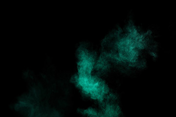 Aquamarine powder explosion on black background. Colored powder cloud. Colorful dust explode. Paint  Holi.