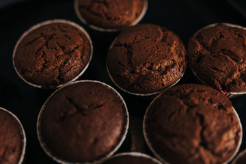 Chocolate muffins bakery. Brownie cupcakes on the baking pan. Baking at home, home bakery.