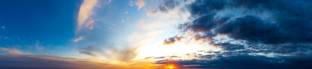 Natural background of the colorful panorama sky. Beautiful cloud in the sunrise sky background. Sky banners background.