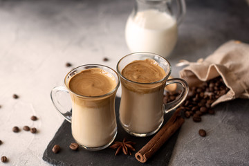 Dalgona coffee. Iced fluffy creamy whipped trend drink with coffee foam and milk. Trendy drink during Covid-19 city lock down and self quarantine, stay at home concept.