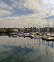 Fototapeta na wymiar yacht boats in marina with sky reflections