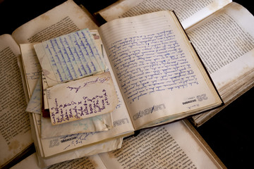 handwrittend papers and antique books