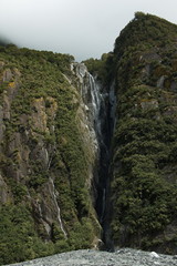 Waterfall at Franz Josef Glacier Walk in Westland Tai Poutini National Park,West Coast on South Island of New Zealand

